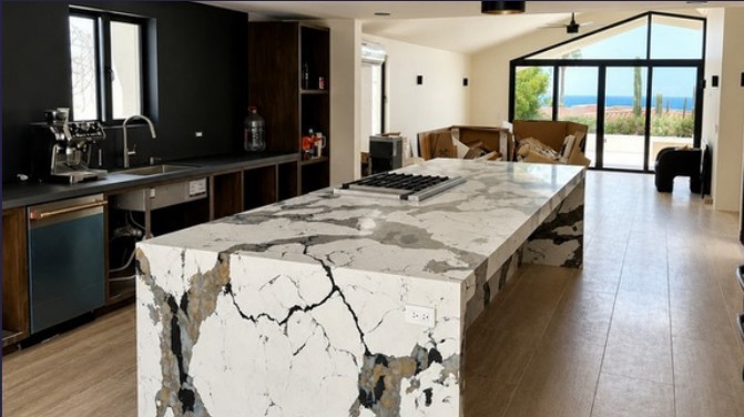 Kitchen with stone island and ocean view